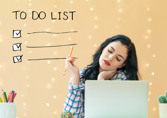 To do list with young woman holding a pencil