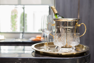 Wine Bottle and Glass in Brass Tray  on counter bar
