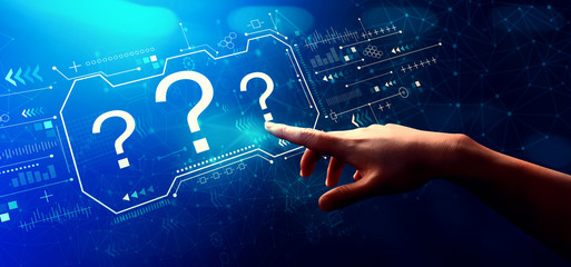 Question marks with hand pressing a button on a technology screen