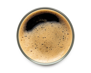 Glass of dark stout beer top view with foam. Isolated on white background. with clipping path.
