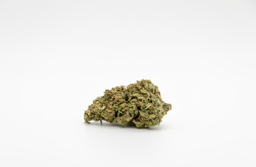 Single marijuana bud on white background