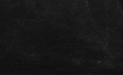 Black chalk board texture background.  Chalkboard, blackboard, school board  surface with scratches and chalk traces. Space for text. - obrazy, fototapety, plakaty