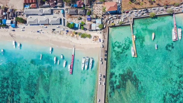 Timelapse Top Down Drone Shot of Cars Entering Nusa Penida Island via Toya Pakeh Harbour. Bali - Indonesia. Holiday Concept
