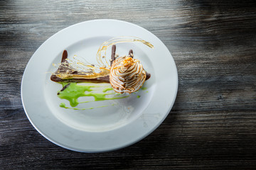 top view on baked elegant swan-shaped cream dessert