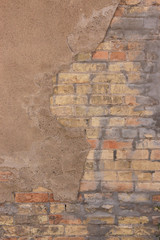 old red brick wall with hole