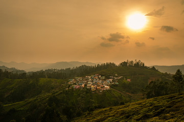 small village on hill top with green forest of western ghat