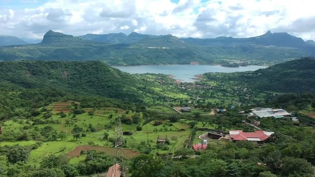 Road trip on Indian road in Monsoon - Rainy season seen here at Dudhiware Khind (pass) at Lonavala, India - most selling stock aerial drone footage.