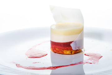 closeup exquisite decorated fruit and cream mousse dessert