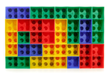 Children's colorful plastic construction toy bricks on white