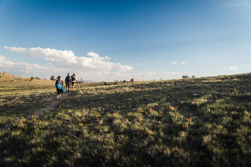 Hikers walking down a hill near Lander, Wyoming during summer.  © Rosemary