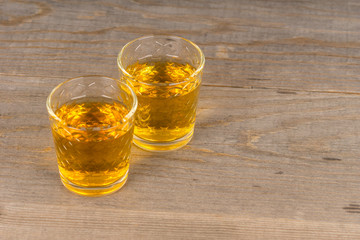 two glasses with homemade sweet wine on wooden table