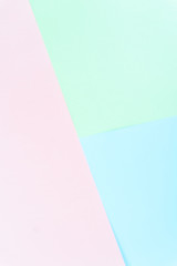 Flat layout of minimal colourful layer of pastel pink , green and blue paper background.