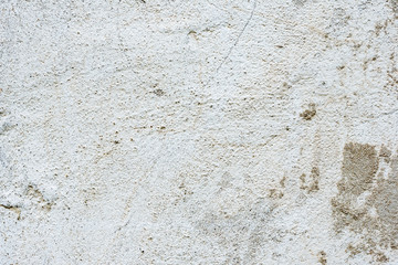 Texture of a concrete wall with cracks and scratches which can be used as a background