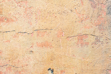 Fototapeta premium Texture of a concrete wall with cracks and scratches which can be used as a background