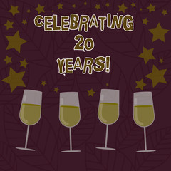 Conceptual hand writing showing Celebrating 20 Years. Business photo text Commemorating a special day being 20 years together Filled Cocktail Wine with Scattered Stars Confetti Stemware