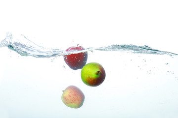 Falling Fruits Into Clean Water 