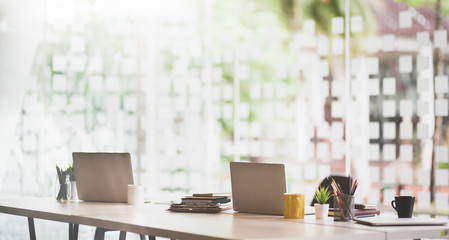 Contemporary workplace with laptops