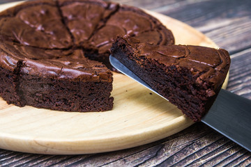 Nutella Brownie with americano coffee and coffee bean on the wood table