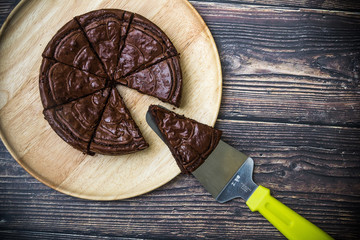 Nutella Brownie with americano coffee and coffee bean on the wood table