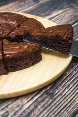 Nutella Brownie with americano coffee and coffee bean on the wood table