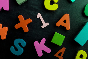 Numbers, letters and blocks on a black background