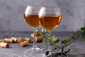 White wine in a glass. The concept of winemaking. Place under your text. Still life on a textural background.