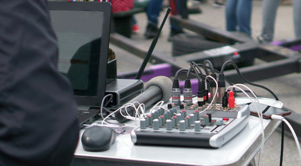 DJ plays music in the city street