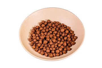 Ceramic plate with chocolate cereal balls isolated on a white background