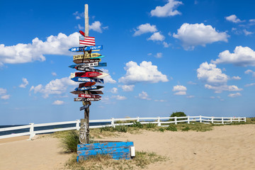 Mile marker signpost at Oceanview Beach in Norfolk, Virginia.