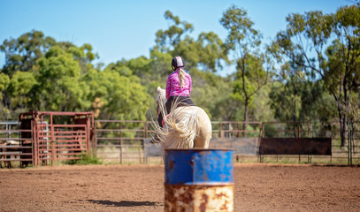 Girl Competing In Barrel Racing At Outback Country Rodeo