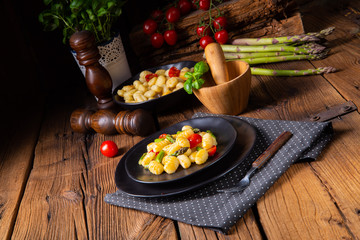 crispy gnocchi with roasted asparagus and tomatoes