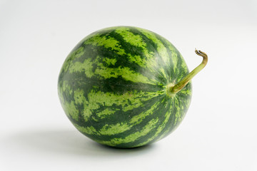 Green watermelon balls on a white background.