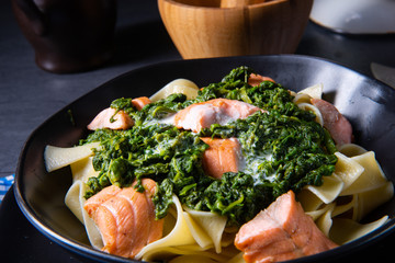 pappardelle pasta with creamed spinach and fried salmon