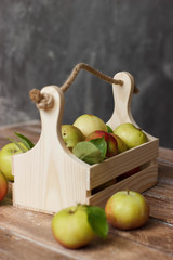 Ripe apples in wooden box. Top view with space for your text
