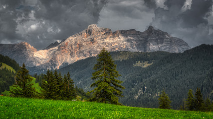 storm clouds and mountains with sunny light