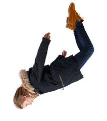 Side view of woman in winter jacket in zero gravity or a fall.