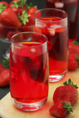Fototapeta na wymiar Glasses with strawberry drink with ice 