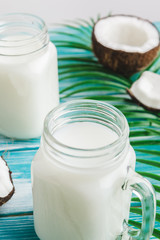 Creative layout made of coconuts and tropical leaves. Food concept