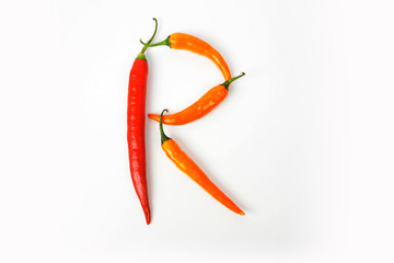 English alphabet. Letter R made of fresh chili pepper isolated on white background. Uppercase letter.