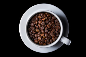 Coffee cup with roasted beans on black background. Top view. isolate