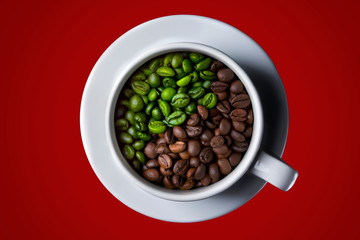 Coffee cup with raw and roasted beans on red background. yin-yang. Top view. coffee in the form of Yin Yang top view