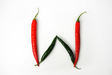 English alphabet. Letter W made of fresh chili pepper isolated on white background. Uppercase letter.