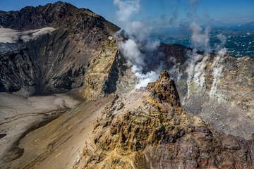 Panoramic view of the city Petropavlovsk-Kamchatsky and volcanoes: Koryaksky Volcano, Avacha Volcano, Kozelsky Volcano. Russian Far East, Kamchatka Peninsula.