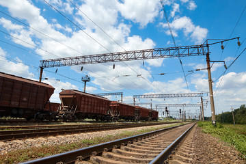 Naklejka premium Industrial railway - wagons, rails and infrastructure, electric power supply, Cargo transportation and shipping concept.
