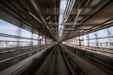 Obraz premium motion-blurred view from a moving train running in tunnel