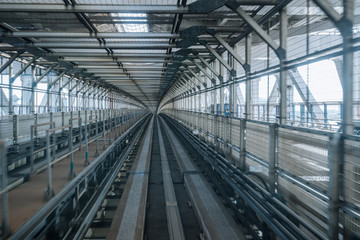 tunnel of monorail road view from front window of a moving train running