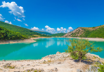 Fototapeta na wymiar Fiastra lake and Lame Rosse canyon - Naturalistic wild attraction in the Monti Sibillini National Park, province of Macerata, Marche region, central Italy