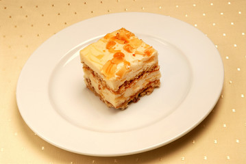 Slice of delicious coconut cake on a white plate