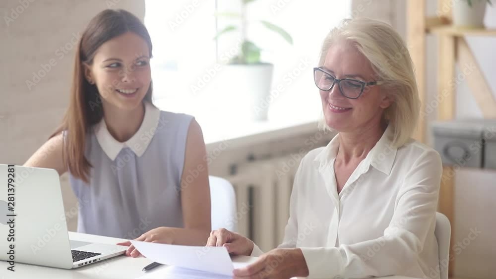 Poster elderly client and company representative shaking hands in office