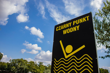 Sign of dirty water in the pond. Black water point.